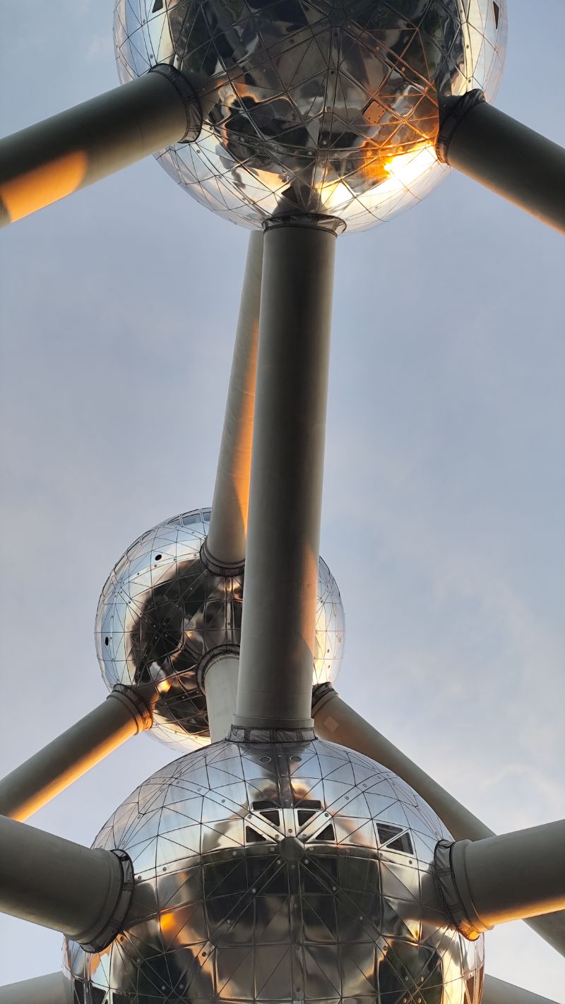 Looking up at steel spheres at sunset