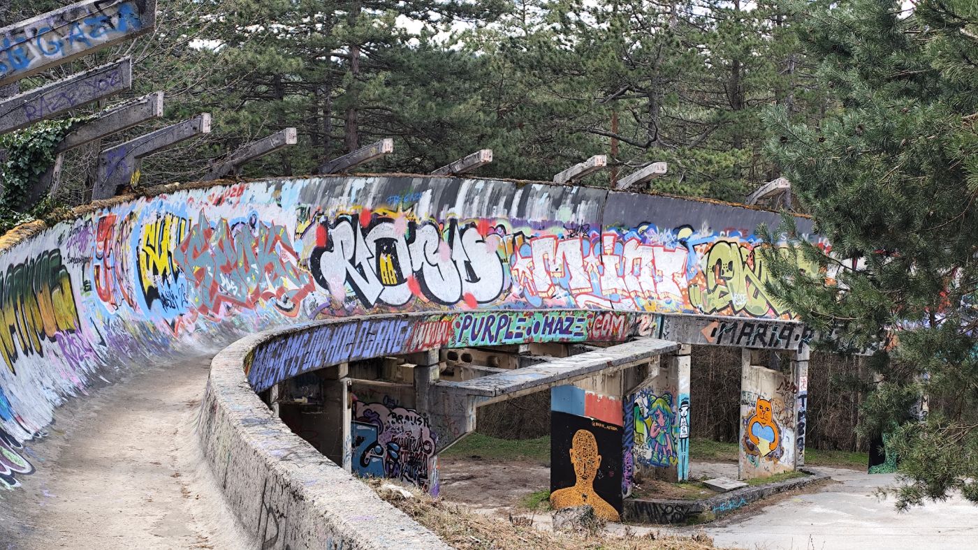 Abandoned bobsleigh track covered in graffiti