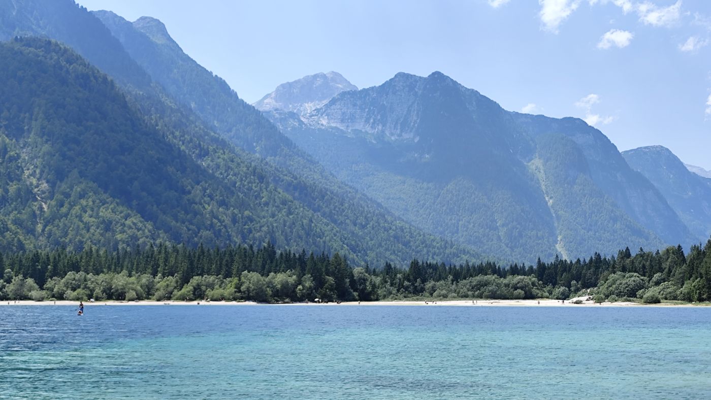 A turquoise mountain lake below limestone peaks